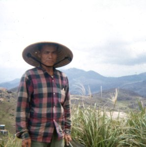 Vietnamese worker at Vung Chua Mountain signal station