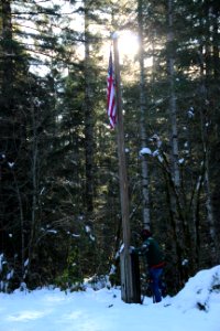 Rainsing the American flag at Hamma Hamma cabin, Olympic National Forest. photo