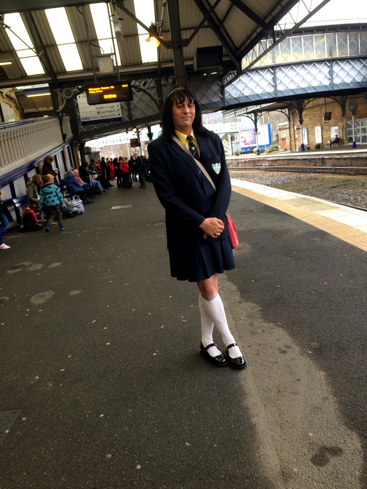 Wearing my girls school uniform on my way home from my holiday