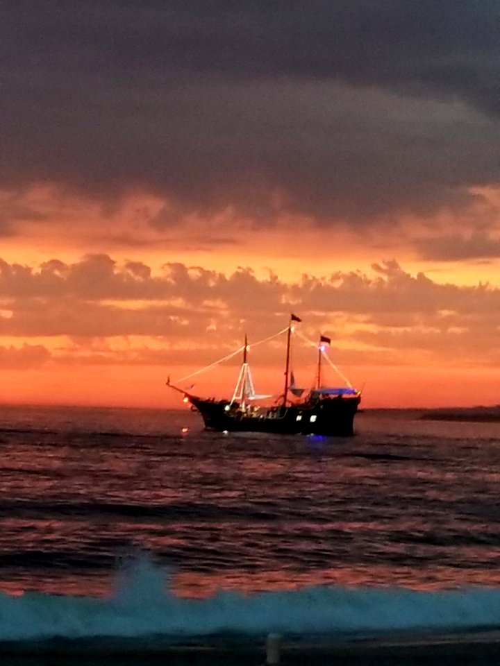 Day 029 pirate ship sailing off in the sunset.