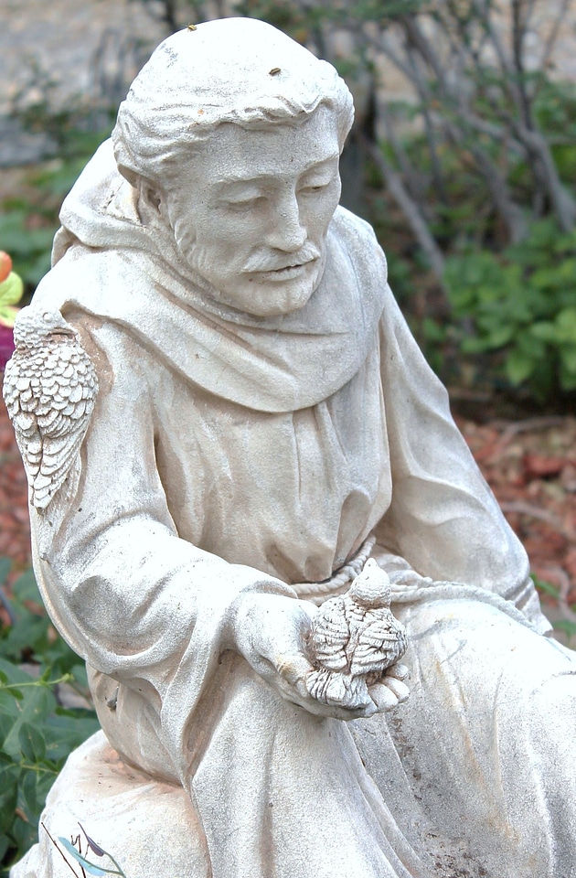 Catholic friar animal communication sculpture