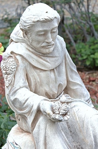 Catholic friar animal communication sculpture