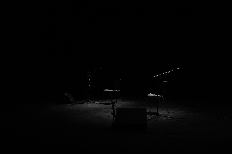Dark microphones chairs photo