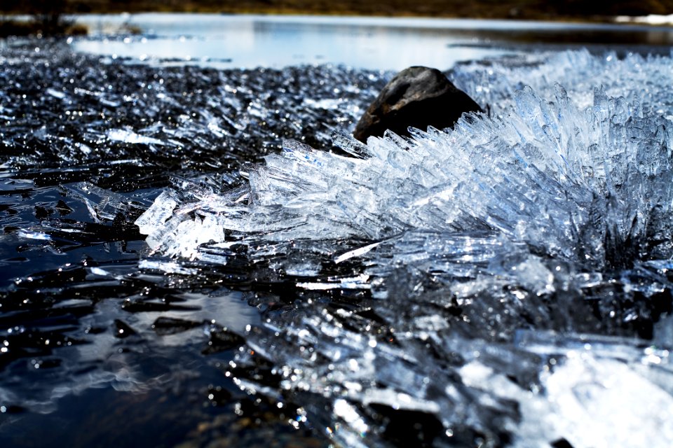 Ice spears on lake photo