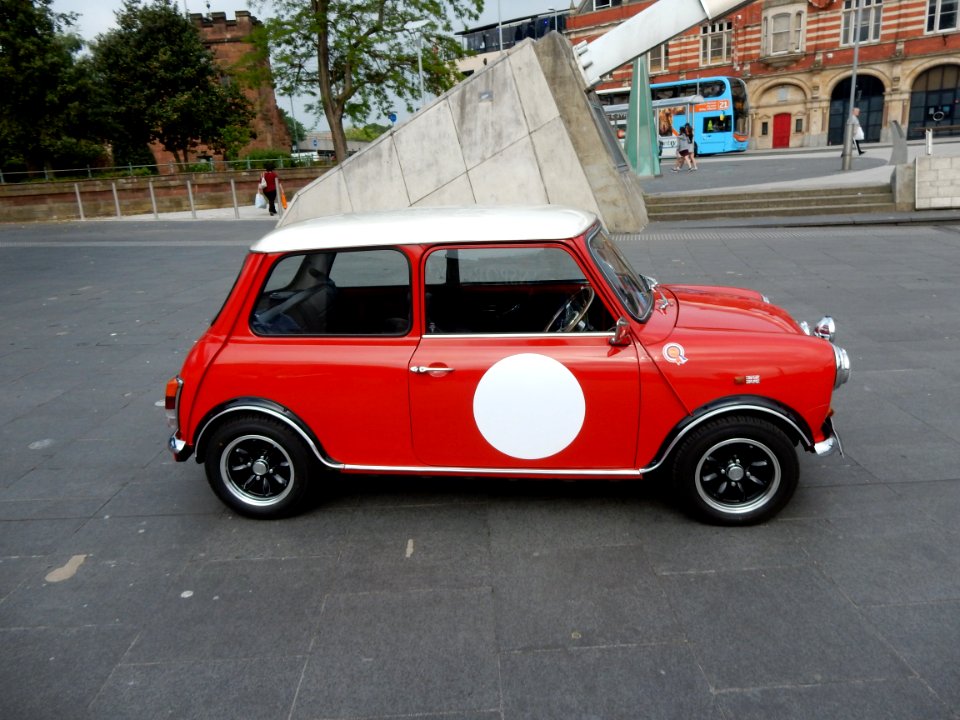 Old red mini with spot side