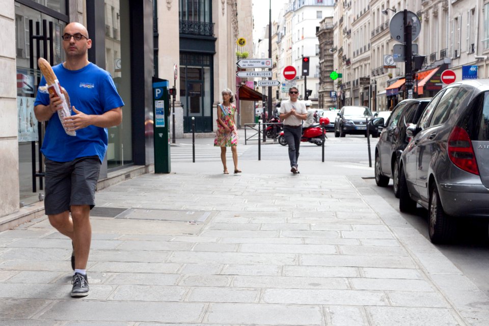 One must always carry a baguette in Paris