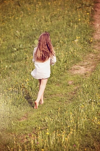 Girl away meadow photo