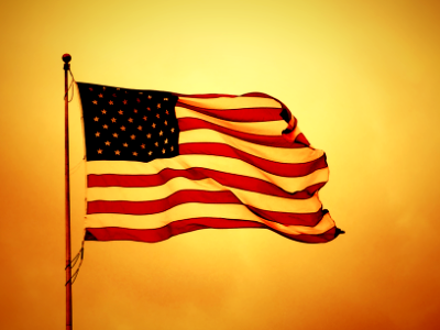 USA flag on yellow backdrop