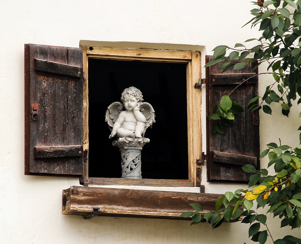 Guardian angel sculpture melancholic