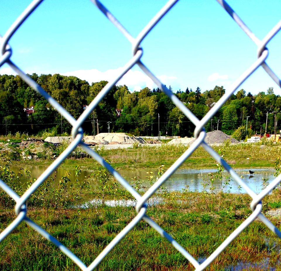 Wire fence over looking a new construction site