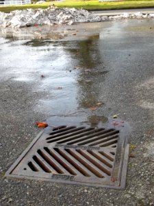 Snow Melt Flowing into Drain