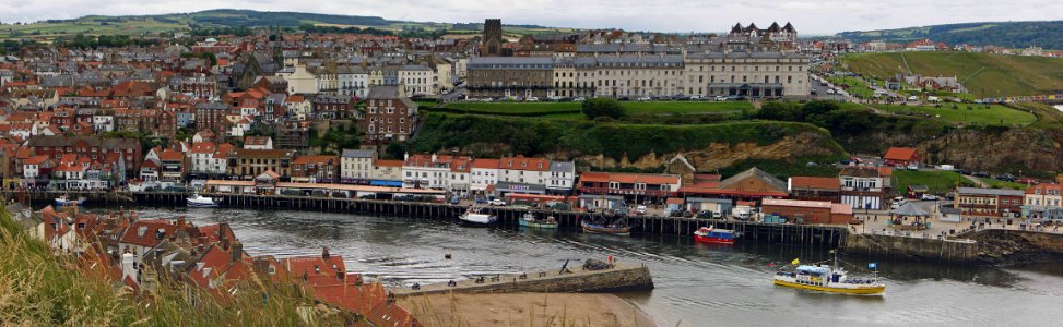 Whitby harbour from the church on the headland photo