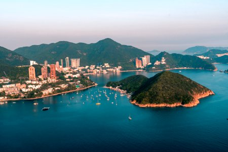 View of clouds, boats, Middle islands, buildings in seaside in Deep Water Bay, Hong Kong seen form brick hill (nam long shan)