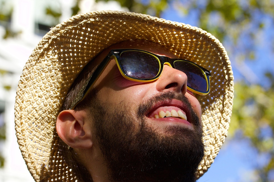 Portrait straw hat sunglasses