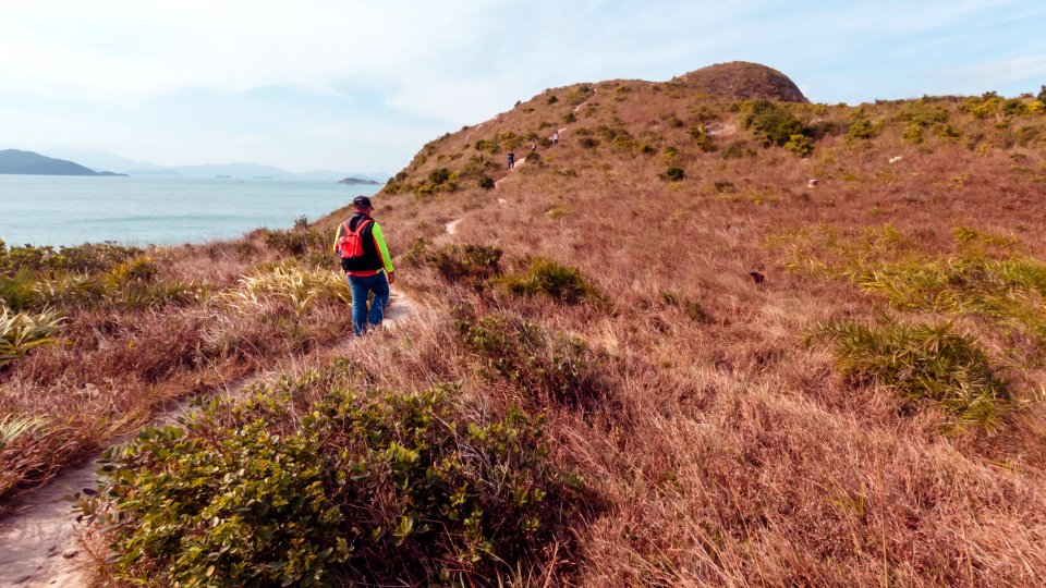 The man is hiking on the hill at Yuk Kwai Shan (Cinnamon Mountain) located in Ap Lei Chau, Hong Kong
