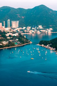 View of clouds, boats, Middle islands, buildings in seaside in Deep Water Bay, Hong Kong seen form brick hill (nam long shan)