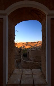 Window view in the abandoned village of Kharanaq, Iran