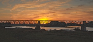 Railway bridge sun sky photo