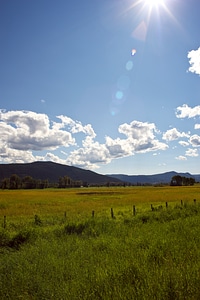 Clouds field fence photo