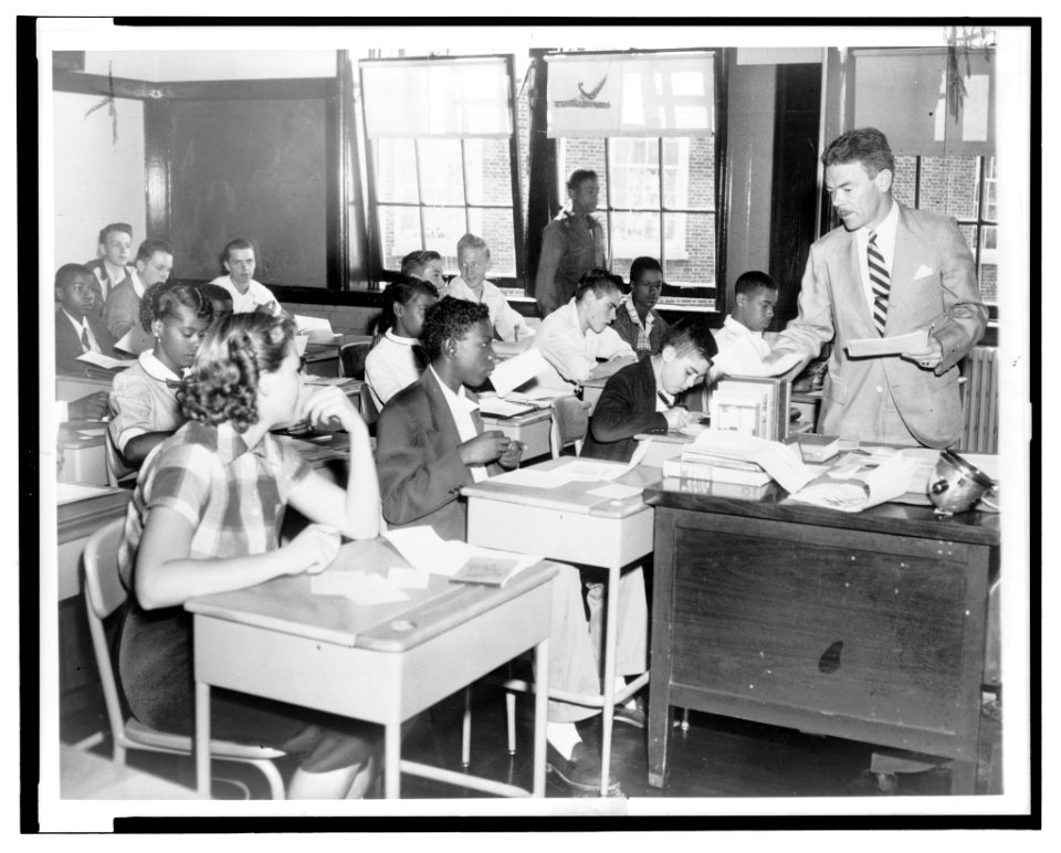 H.B. Sanders, right, gives instructions to members of a 10th grade class at McKinley Technical High School as the new District of Columbia public school term opens Sept. 13 [1954]