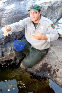 Ecologist Evan Gwilliam performing an aquatic survey. Photo by NPS/Todd M. Edgar.