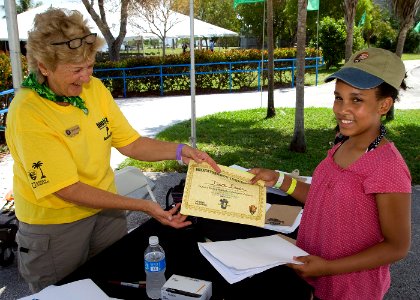 Biodiversity youth ambassador Dara receiving certificate. NPS photo.