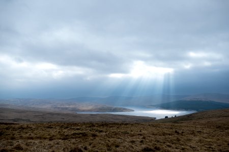 Sun breaking through on Daer Reservoir