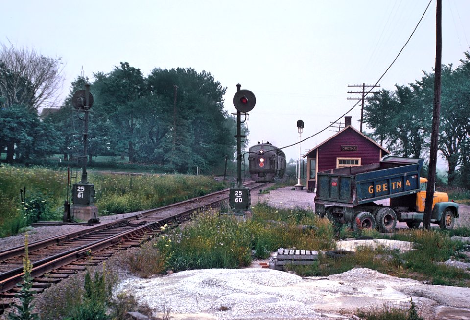 CGW 115-A (F5A) with Train 143 approaching he Gretna, IL station on July 4, 1962