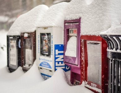 Snow-Covered Newsstands in Washington, DC
