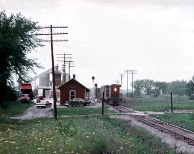 CGW 121 (GP7) eastbound peddler (local) freight at Gretna, IL station on August 14, 1962