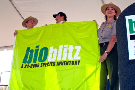 Passing the official flag to Rocky Mountain National Park for the 2012 BioBlitz. Photo by NPS/Todd M. Edgar. photo