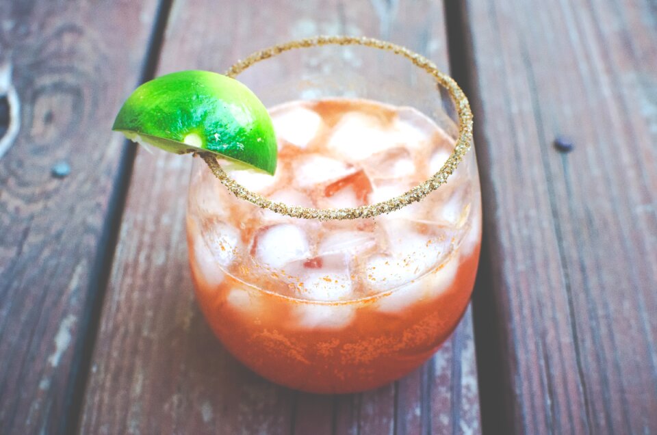 Glass drink lemon wedge
