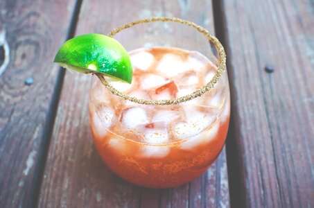 Glass drink lemon wedge