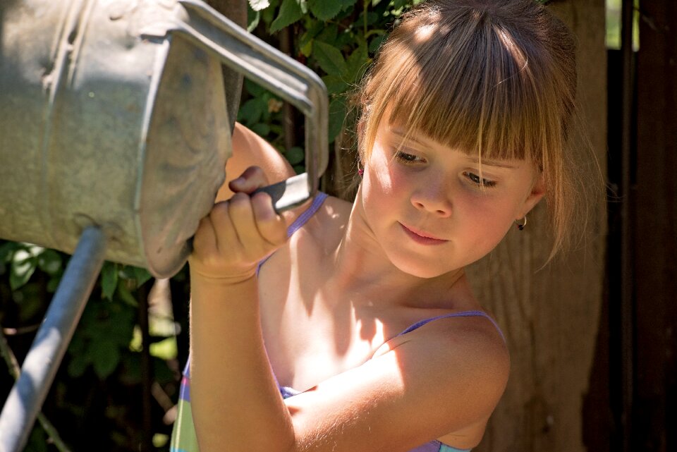 Girl face watering can