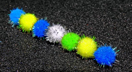 Fluff balls  all in a row.