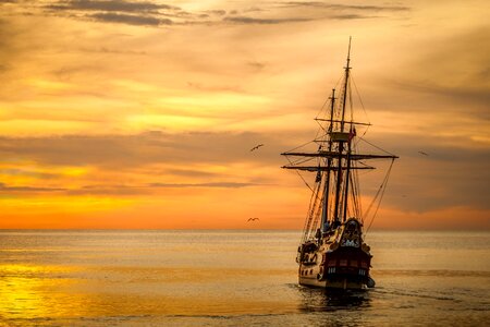 Sea ship orange sunset