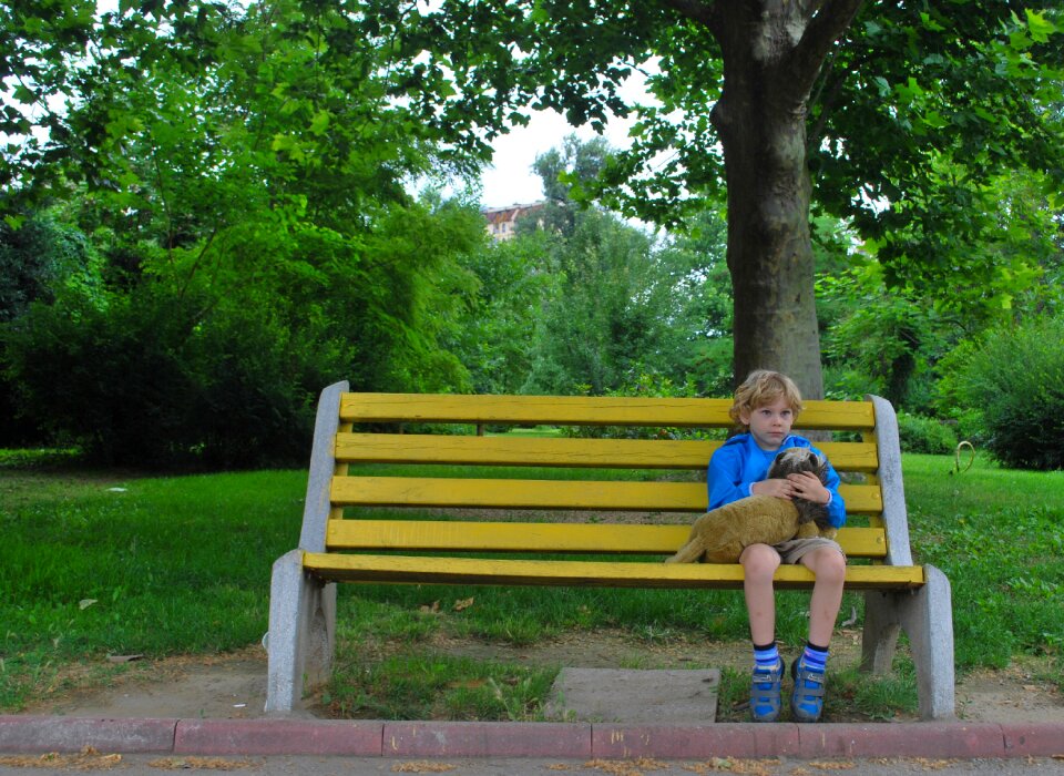 Boy alone sitting photo