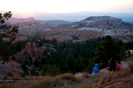 Family watches the Sunrise along Rim Trail photo
