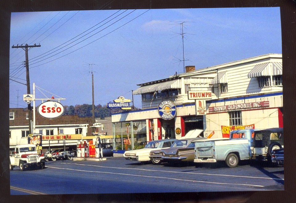 Triumph car dealer old postcard