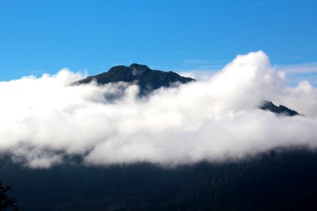 Cloudy mountain viewed from the top of Mt. Roberts looking towards Douglas Island in Juneau, Alaska.