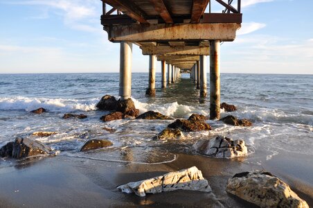 Rocks breakwater wooden bridge photo