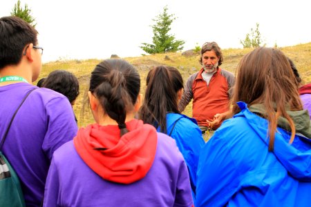 U.S. Forest Service Researcher Chrales Cristafulli presenting the aquatic creatures of the ponds at Mount St. Helens