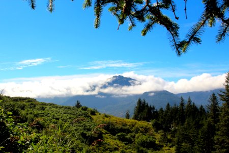 Cloudy mountain viewed from the top of Mt. Roberts looking towards Douglas Island in Juneau, Alaska.