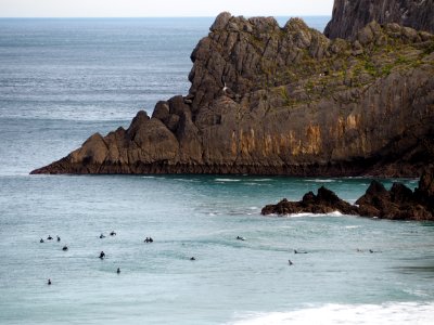Surfers at Laga Beach, Basque Country photo