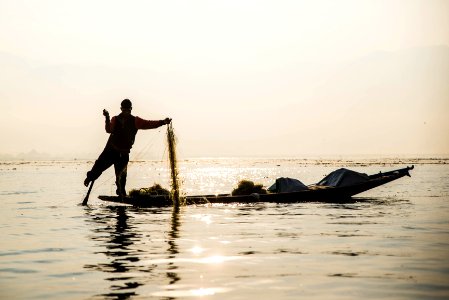 Burmese Fisherman in the early morning on Inle Lake, Myanmar photo