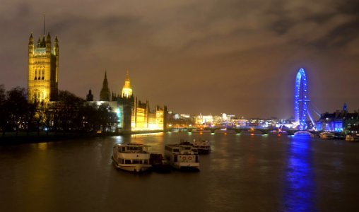 Houses of Parliament & London Eye, River Thames, London photo