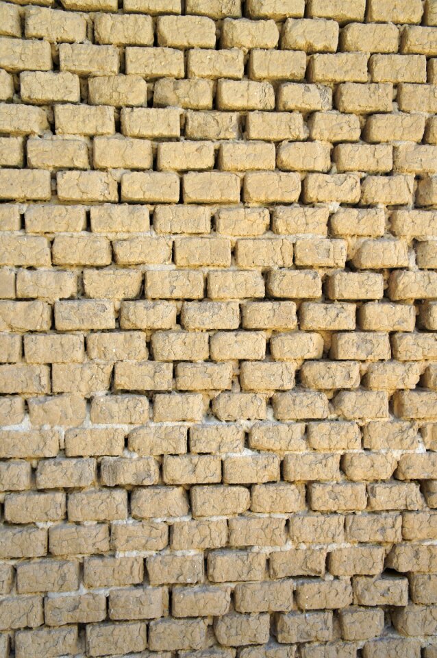 Clay bricks wall background photo
