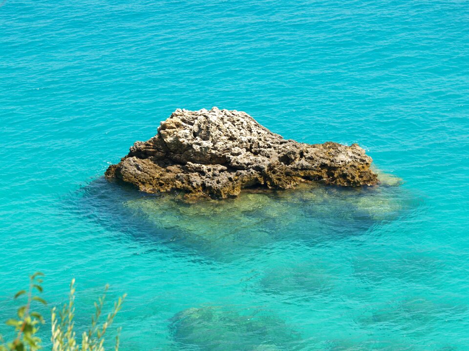 Blue turquoise the rock in the water
