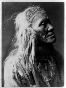 Kittitas man, head-and-shoulders portrait, facing right. Edward S. Curtis. c 1910