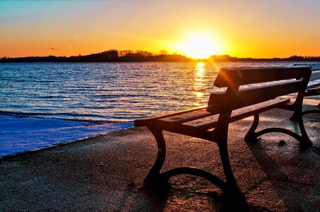 Lake bench sunset photo